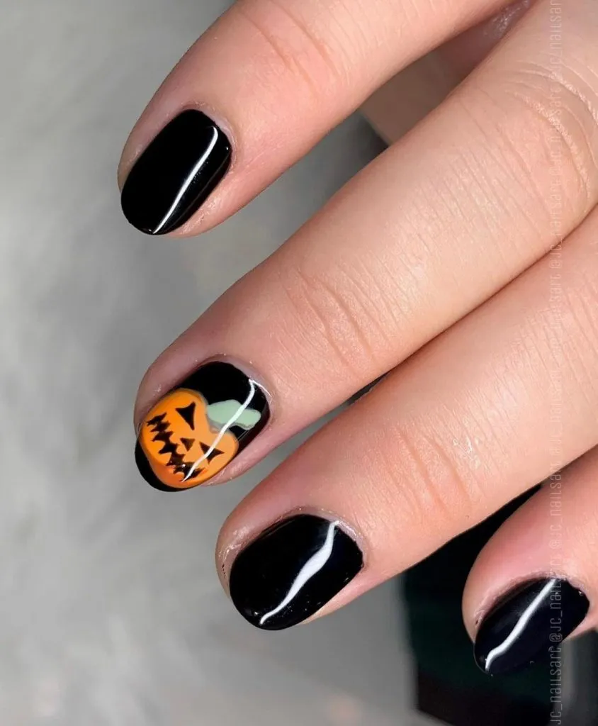 black and orange pumpkin nails
